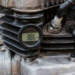 Digital cylinder head temperature gauge mounted on an air-cooled motorcycle engine