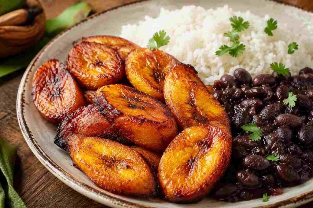 Best maduros fritos near me - caramelized fried sweet plantains with rice and beans