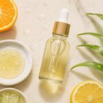 Serumcu serum bottle with skincare ingredients like vitamin C and aloe vera on a marble background