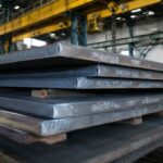 StE500 steel plate stacked in industrial warehouse