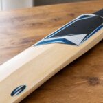 Cricket bat stickers applied to the blade face and toe on a willow bat
