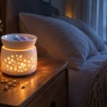 Moonlight wax melts glowing in a floral ceramic warmer on a nightstand